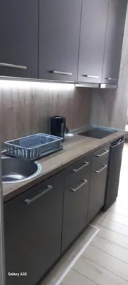 a kitchen with a sink and a counter top at Apartman 018 in Soko Banja