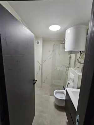 a bathroom with a toilet and a sink at Kopaonik Alibi IRIS10 in Kopaonik