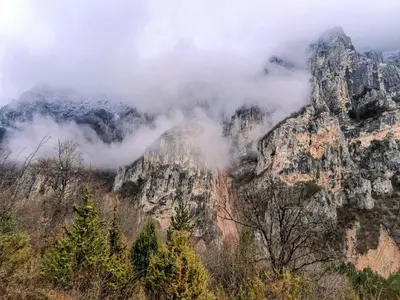 a mountain with clouds on top of it at Vila Dika in Poganovo