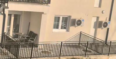 a building with speakers on the side of it at Apartman KUM in Vrnjačka Banja