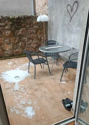 a patio with a table and chairs and a table and a table and chairs at Centar & peace in Niš