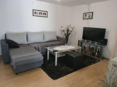 a living room with a couch and a coffee table at Miris Proleća in Rekovac