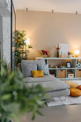 a living room with a couch and a yellow pillow at Studio49apartments Quiet in Niš Free Private Parking Fast WiFi in Niš