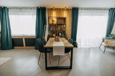 a dining room with a table and chairs at Studio49apartments Quiet in Niš Free Private Parking Fast WiFi in Niš