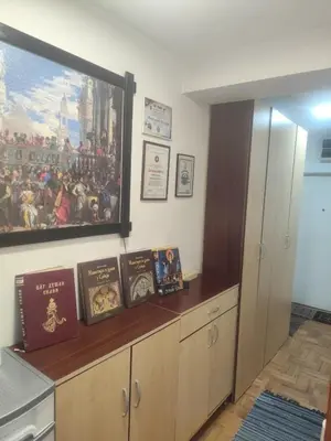a kitchen with a large painting on the wall at Agape in Niš