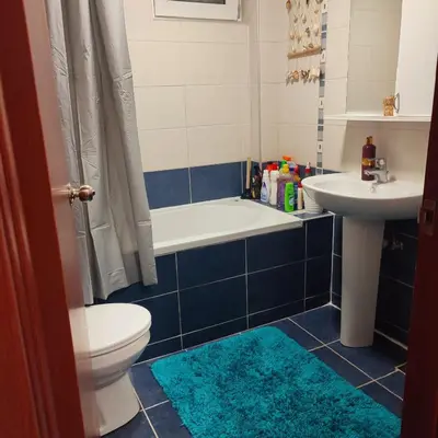 a bathroom with a toilet and a sink and a tub at Banjski apartman in Vrnjačka Banja
