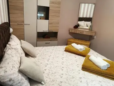 a bedroom with a bed with two towels on it at Apartman SIMONA in Bor