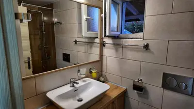 a bathroom with a sink and a mirror at Apartman SIMONA in Bor