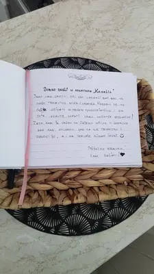 a piece of paper sitting on top of a basket at Apartman Kamelia in Jagodina