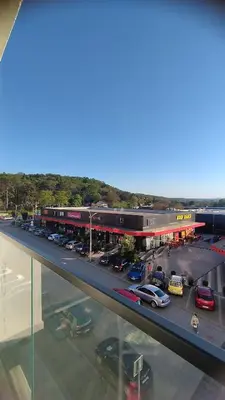 a view of a parking lot with cars parked at Apartman Kamelia in Jagodina