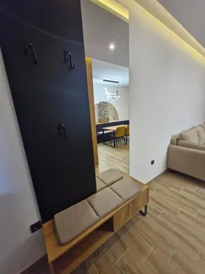 a living room with a couch and a table at RELAX RESIDENS-kopaonik in Kopaonik