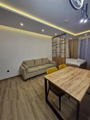 a living room with a couch and a table at RELAX RESIDENS-kopaonik in Kopaonik