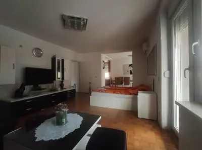 a large living room with a bed in the background at VILA RUŽA - Grand apartman 2 in Soko Banja