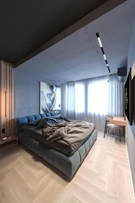 a bedroom with a large bed in a room at Open Space in Niš