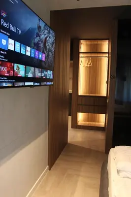 a room with a flat screen tv on the wall at Open Space in Niš