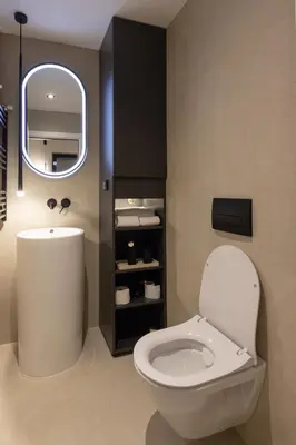 a bathroom with a white toilet and a mirror at Open Space in Niš