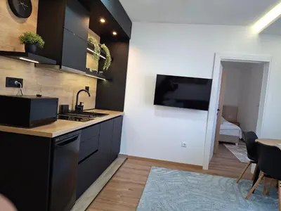 a kitchen with a sink and a counter top at President kop APP Katarina II free wellnes&spa in Kopaonik