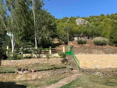 a garden with stairs and a fence and trees at Vila Petrov in Lukavica
