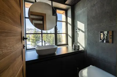 a bathroom with a sink and a window at NOOK Kopaonik Luxury Apart & House in Kopaonik