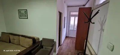 a living room with a couch and a hallway at Apartmani Vučić in Soko Banja