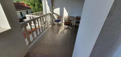 a view of a balcony with a table and chairs at Apartmani Vučić in Soko Banja