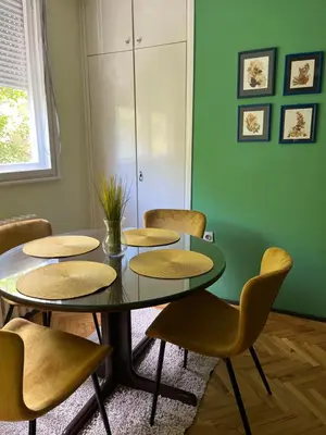 a meeting room with a table and chairs at Cozy place for a perfect trip next to Delta Planet in Niš