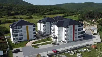 an overhead view of two large apartment buildings at COMODO 