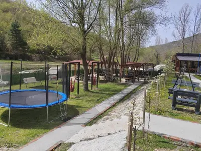 a playground with a trampoline in a park at Prenociste Vranjska banja in Vranjska Banja
