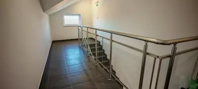 a stairway with a metal railing and a window at Studio Dumitrašković in Soko Banja