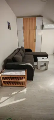a living room with a couch and a coffee table at Studio Dumitrašković in Soko Banja