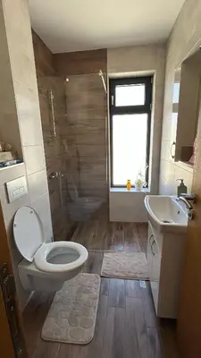 a bathroom with a toilet and a sink at Apartman Nina in Soko Banja