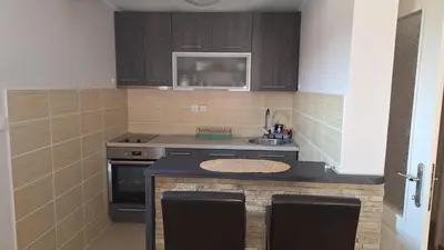 a small kitchen with a sink and a stove at Royal Lux in Soko Banja