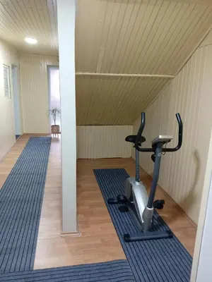 a room with a gym with a exercise bike at Zen apartman in Zaječar
