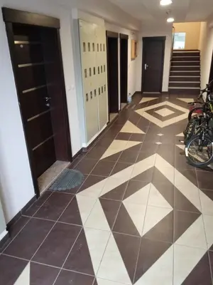 a hallway with a tiled floor with motorcycles parked at Banjski Raj in Vrnjačka Banja