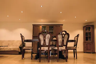 a dining room with a table and chairs at Villa Perla in Despotovac