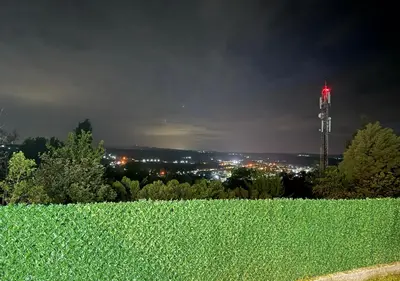 a view of a cell phone tower at night at Villa Perla in Despotovac