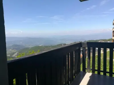 a balcony with a view of the mountains at Appartement Kopaonik in Raška