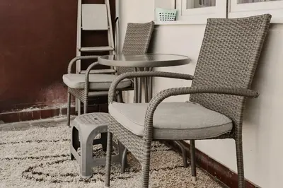 a group of chairs and a table and a table at Apartman ELEVEN in Kraljevo