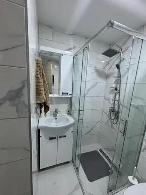 a bathroom with a sink and a shower at Apartman Mirka, Vrnjačka Banja in Vrnjačka Banja