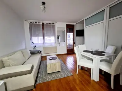 a living room with a couch and a table at See U in Pegaz in Vrnjačka Banja