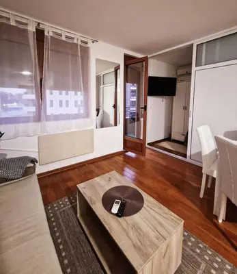 a living room with a couch and a coffee table at See U in Pegaz in Vrnjačka Banja