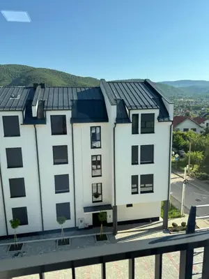 a building with solar panels on its roofs at Apartman TRIP in Soko Banja