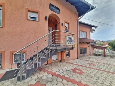 a building with a staircase on the side of it at Vila Aleksandra 1 Sokobanja in Soko Banja