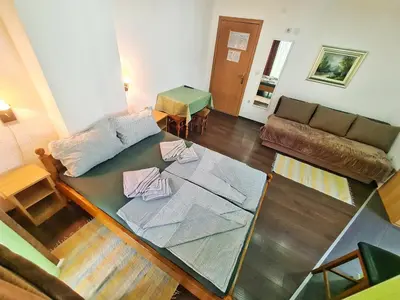a living room with a glass table and a couch at Vila Aleksandra 1 Sokobanja in Soko Banja