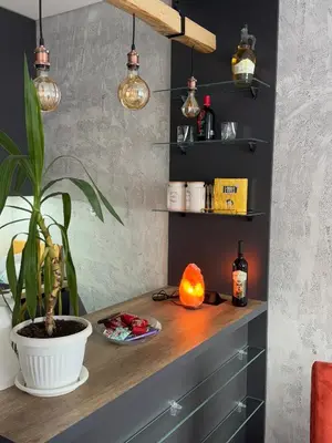 a room with a desk with a plant and lights at Apartman ViR in Soko Banja
