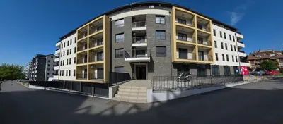 a large apartment building on the corner of a street at Apartmani Central A20 & Free parking in Vrnjci