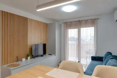 a living room with a couch and a television at Apartmani Central A11 & Free parking in Vrnjci