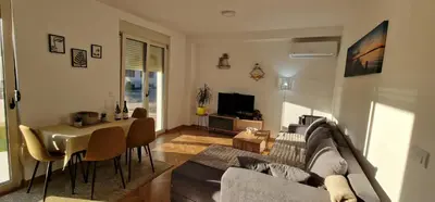 a living room with a couch and a table at Apartman Vera in Vrnjačka Banja