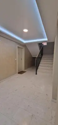 an empty room with a staircase and a ceiling at Apartman Vera in Vrnjačka Banja