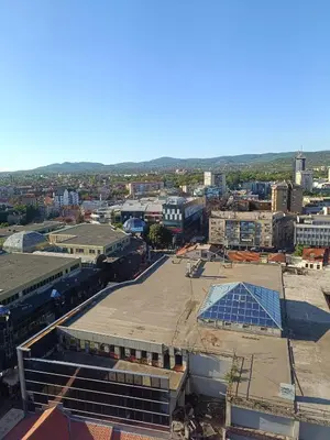 an aerial view of a city with a large parking lot at Plan B in Niš